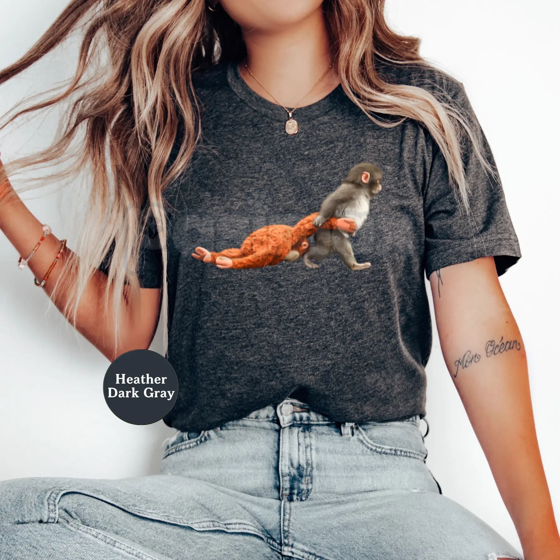 Monkey Punch Baby Monkey Graphic T-Shirt - Cute Baby Monkey Holding Plush Toy Shirt, Premium 100% Cotton Animal Lover Tee, Whimsical Wildlife Illustration Top, Adorable Primate Cuddle Graphic Apparel, Soft Lived-In Unisex Nature Tee