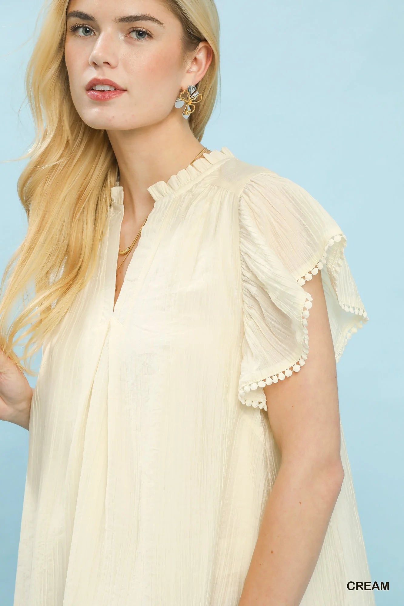 Umgee Flutter Sleeve Relaxed Top with Trim Detail