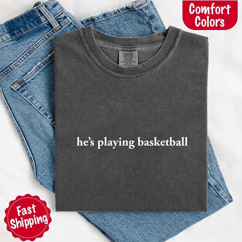 He’s Playing Basketball – Funny Sports Girlfriend Comfort Color Shirt for Women