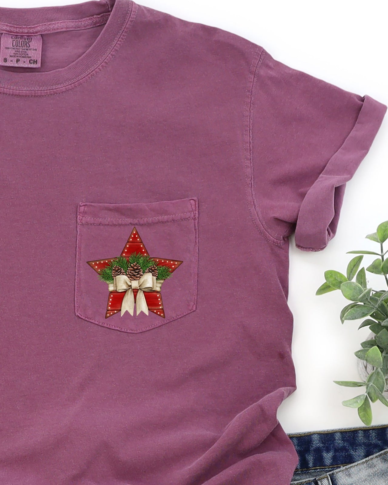 Christmas Star Pocket With Pine Cones And Ribbon Winter Snow Santa Scene Comfort Colors Tee