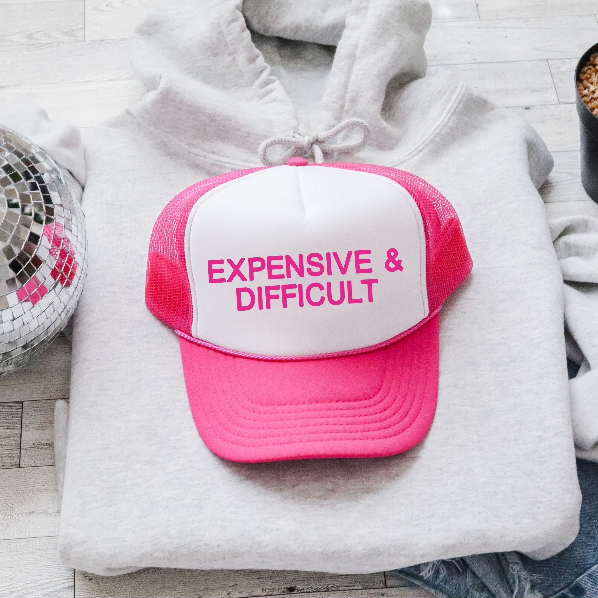Expensive & Difficult, Sassy, Funny, Bold, Playful, Loud, Provocative, Iconic Trucker Hat