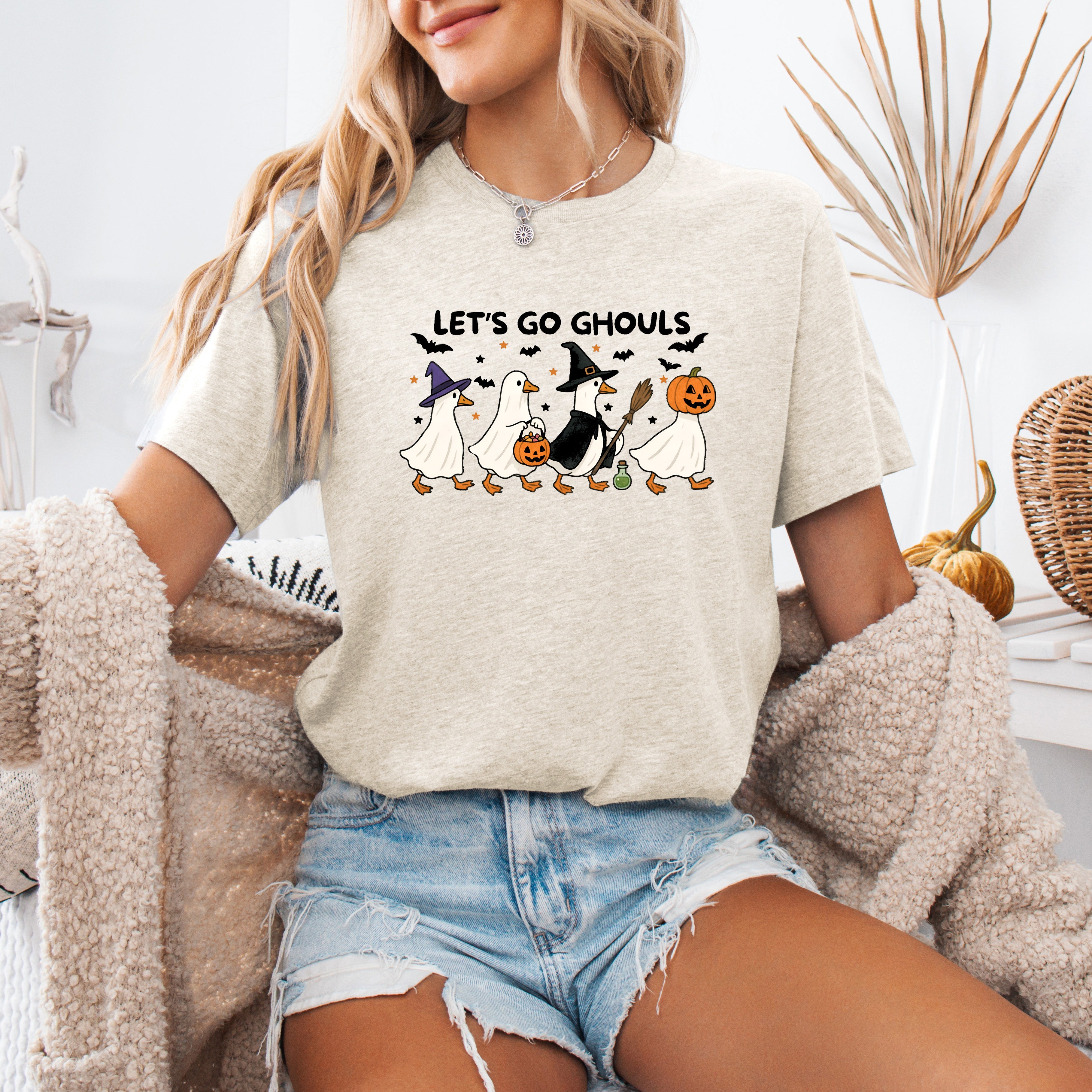 Let's Go Ghouls Geese With Witch Hats For Halloween Night Grinning Goose Parade Graphic Tee