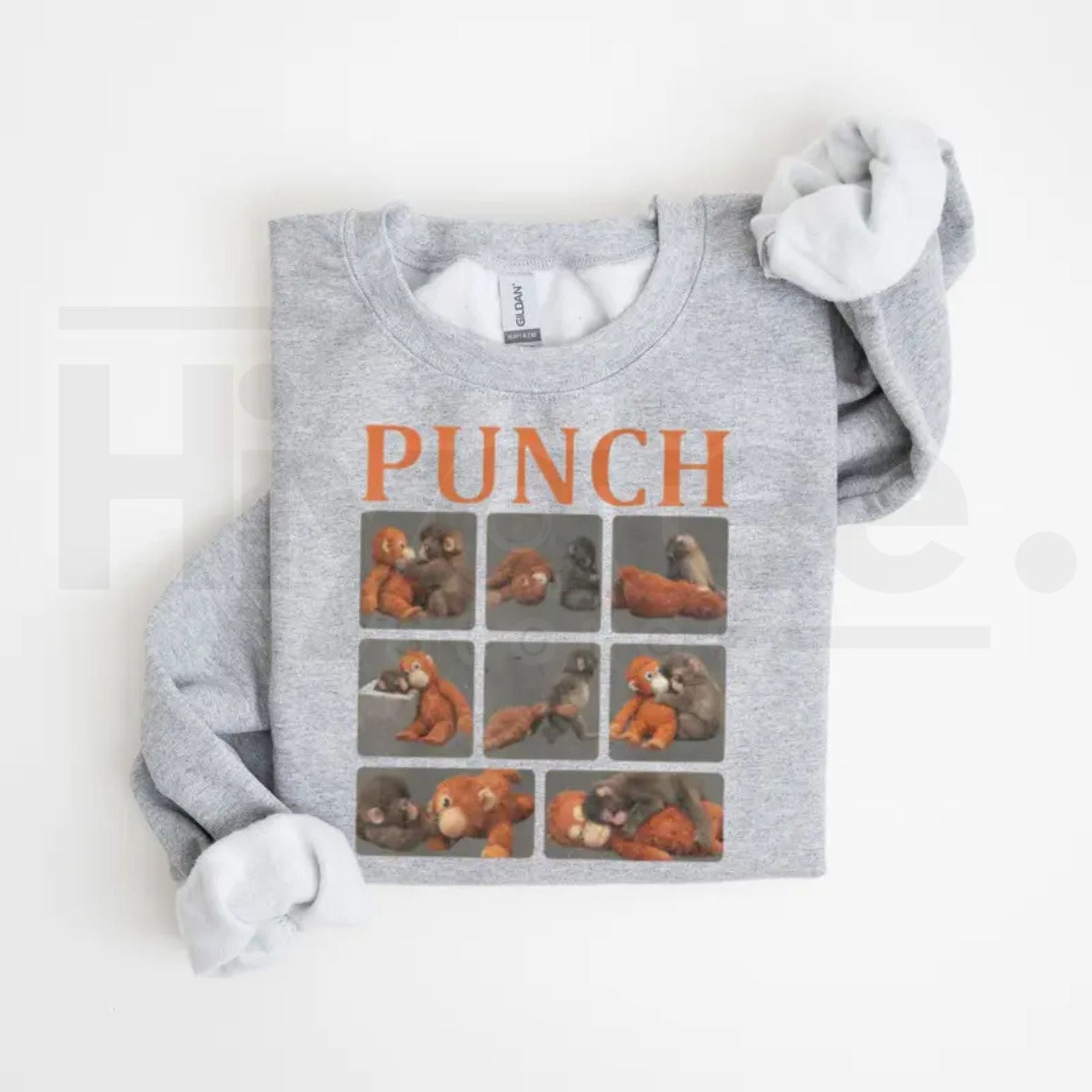 Monkey Punch Graphic Sweatshirt: Cute Baby Monkey Holding Plush Toy Crewneck