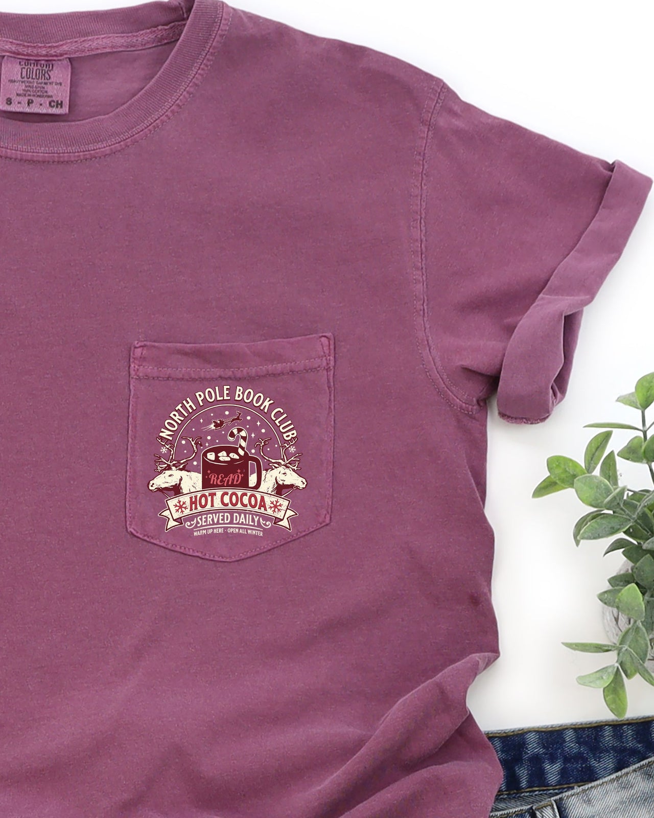 North Pole Book Club Pocket Hot Cocoa Christmas Winter Snow Reindeer Santa Xmas Comfort Colors Tee