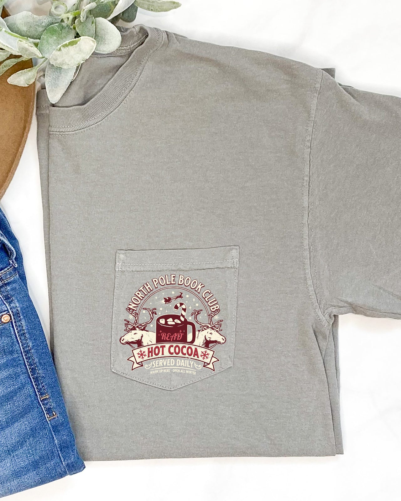 North Pole Book Club Pocket Hot Cocoa Christmas Winter Snow Reindeer Santa Xmas Comfort Colors Tee
