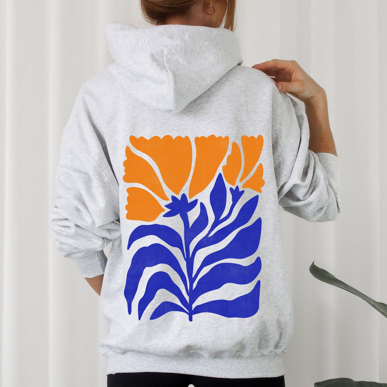 Floral Design With Bold Blues And Oranges And Intricate Petal Patterns For A Standout Look Hoodie