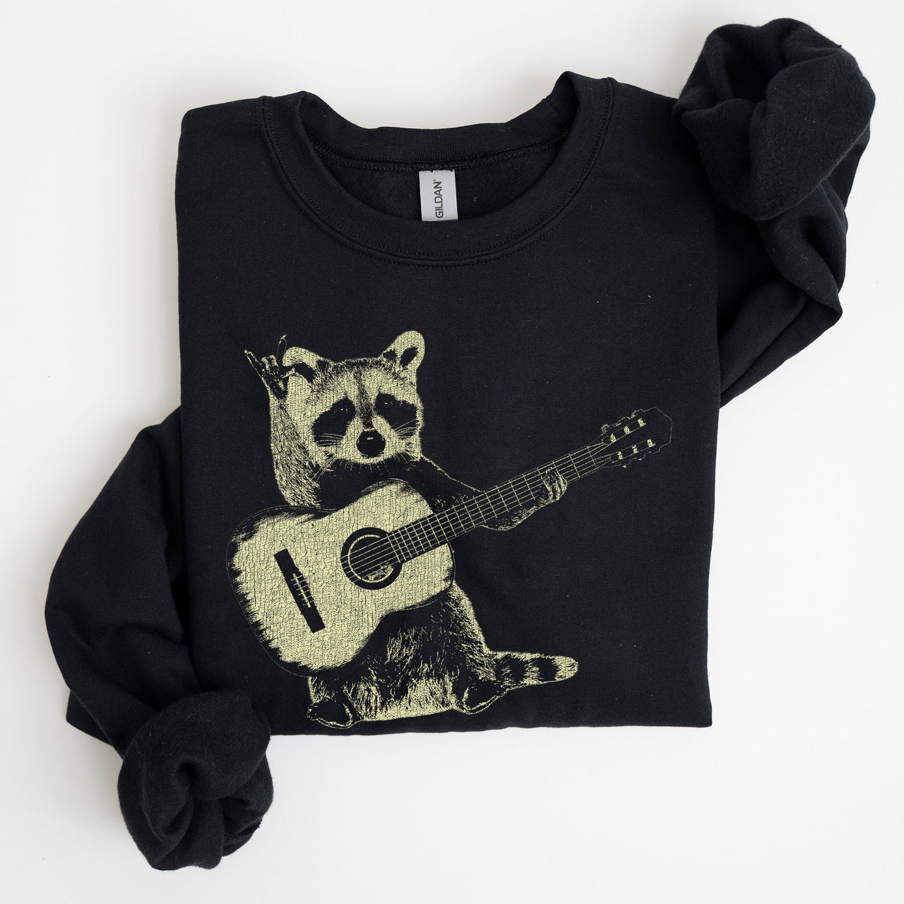 Raccoon Playing A Guitar In A Whimsical Forest Scene With Playful Vibe Sweatshirt