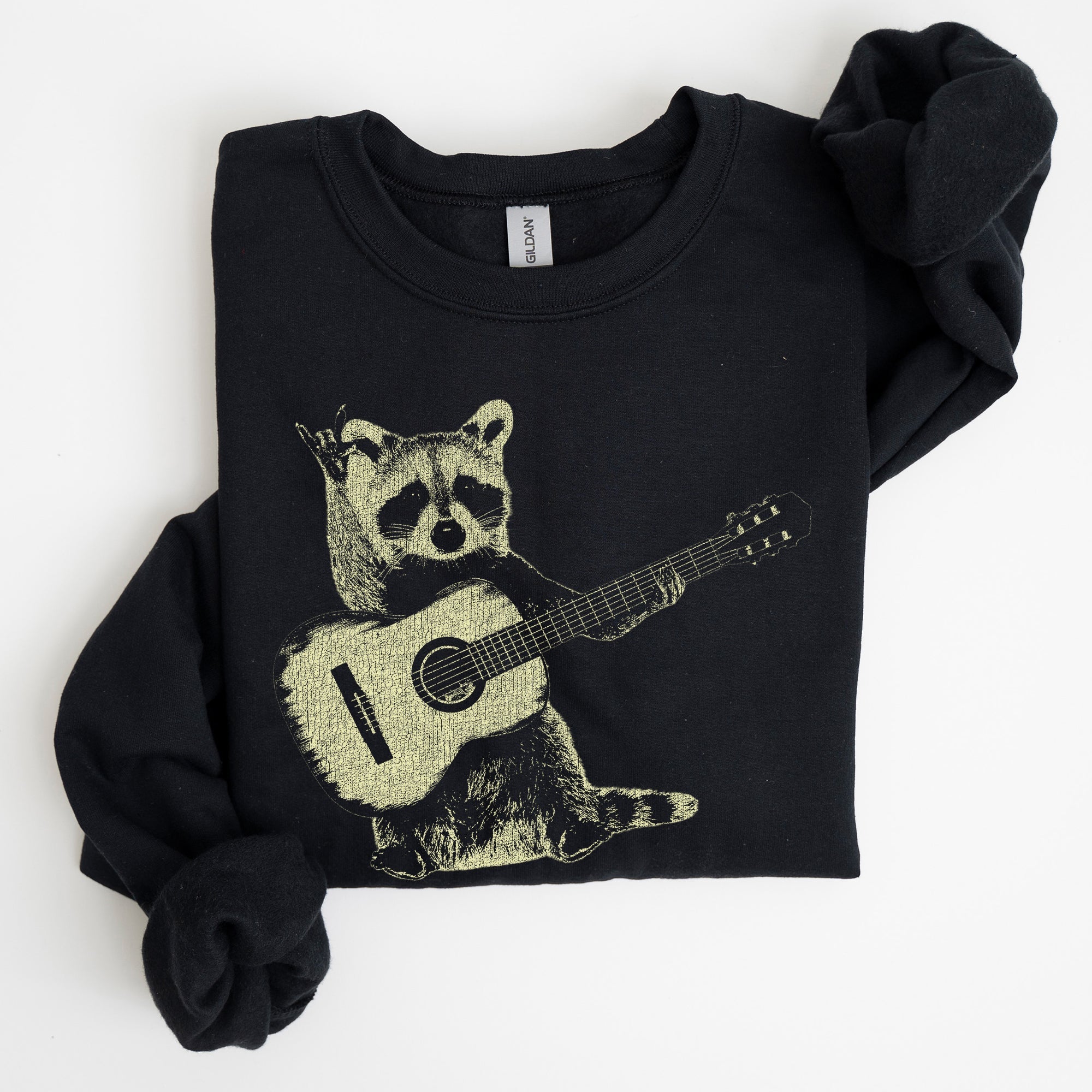 Raccoon Playing A Guitar In A Whimsical Forest Scene With Playful Vibe Sweatshirt