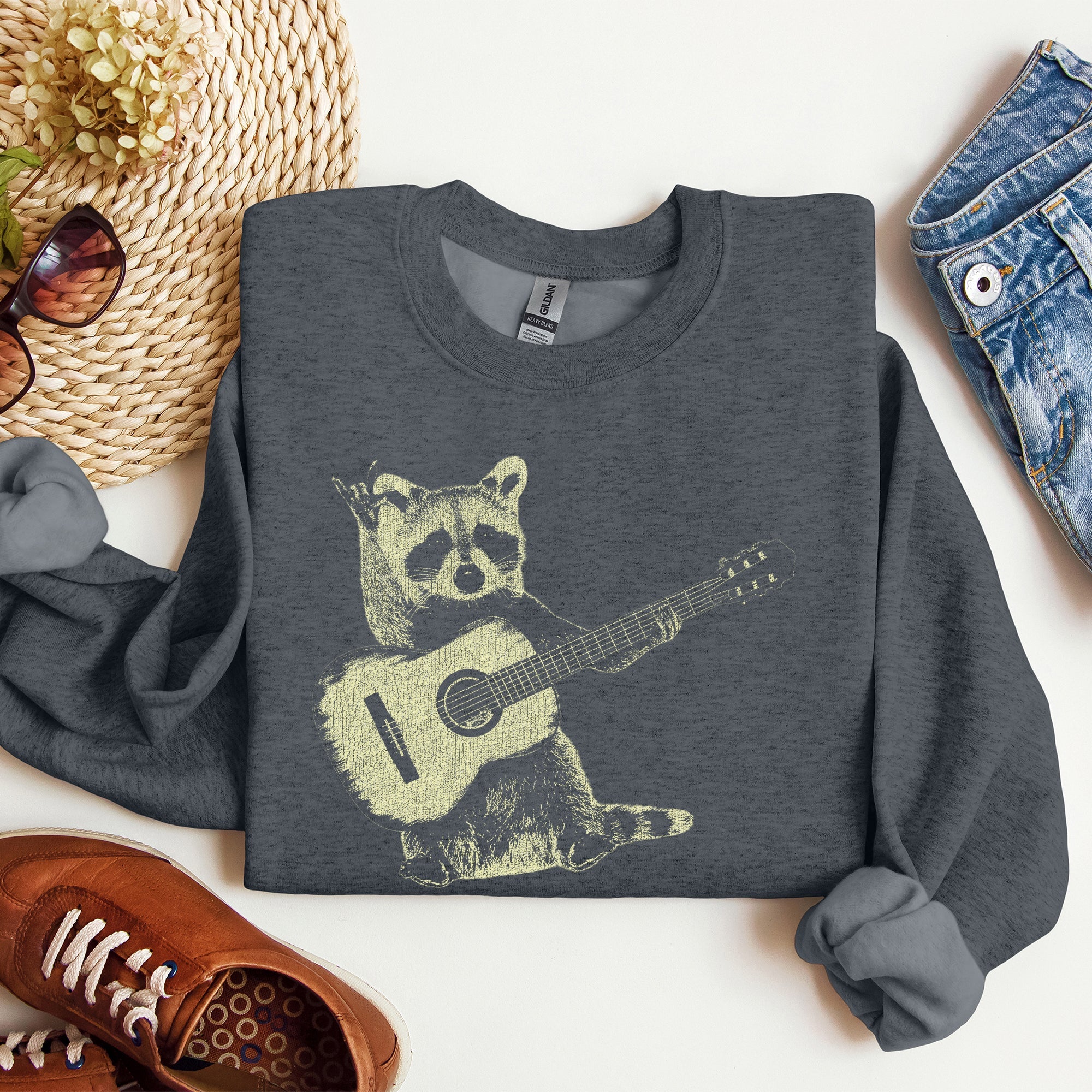 Raccoon Playing A Guitar In A Whimsical Forest Scene With Playful Vibe Sweatshirt