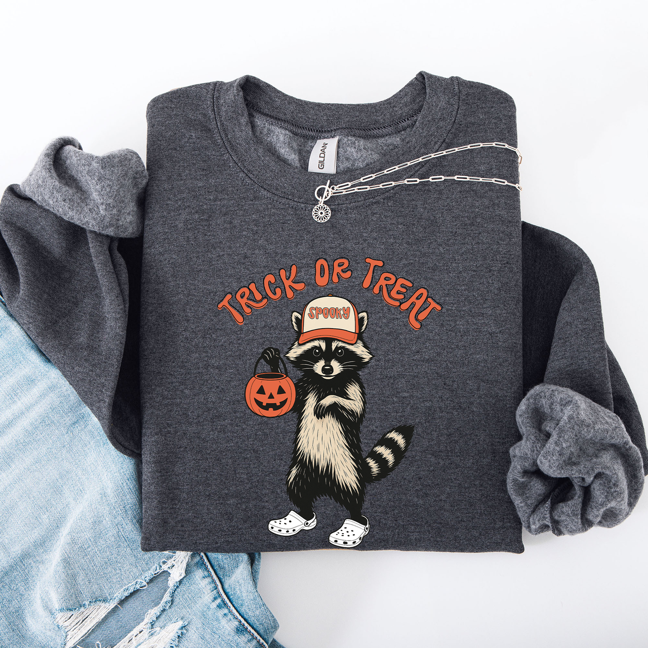 Raccoon Trick Or Treat Halloween Spooky Cozy Nighttime Autumn Theme Seasonal Fun Sweatshirt