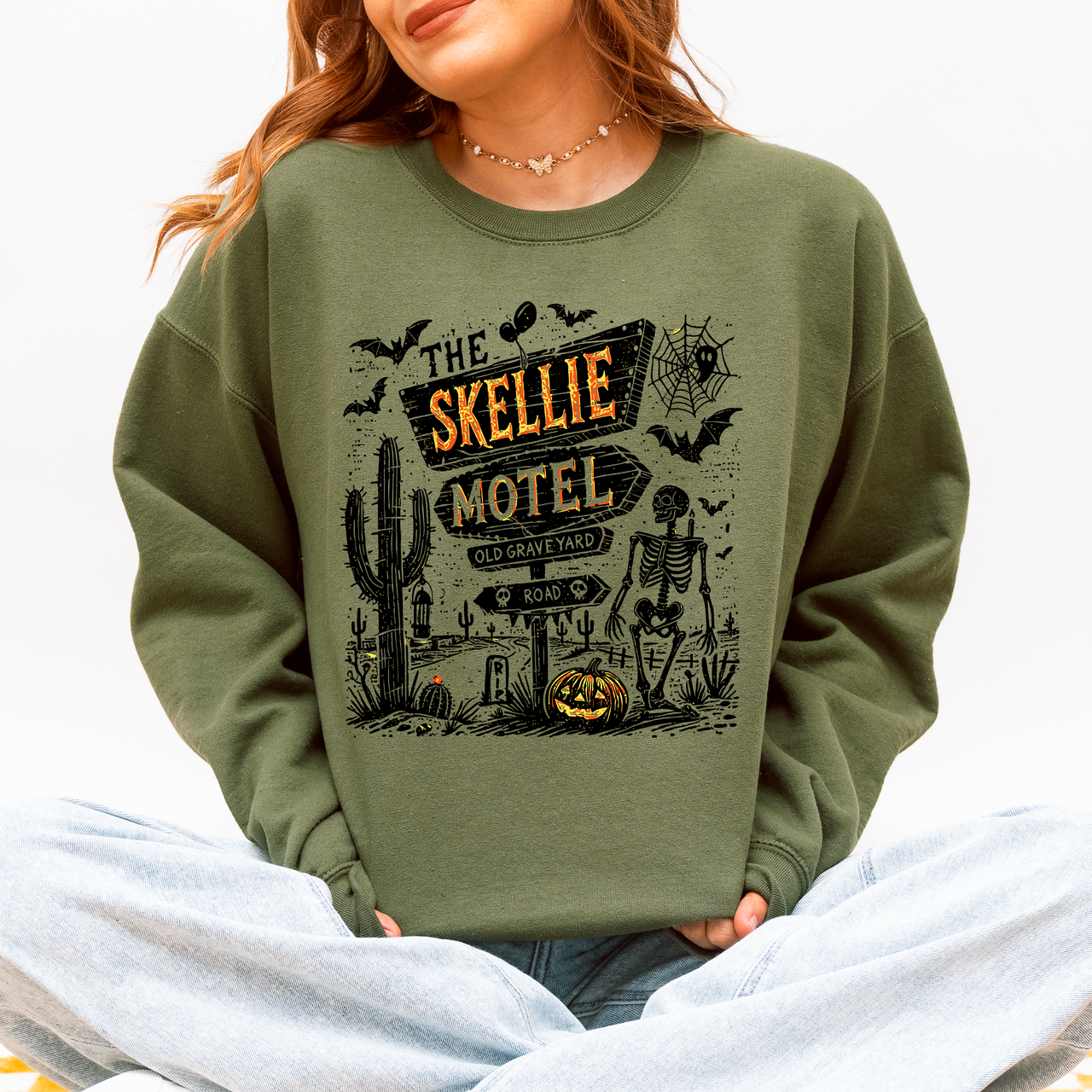 The Skellie Motel Skeleton Halloween Night Haunting Edition With Spooky Vibes And Retro Motel Aesthetic Sweatshirt