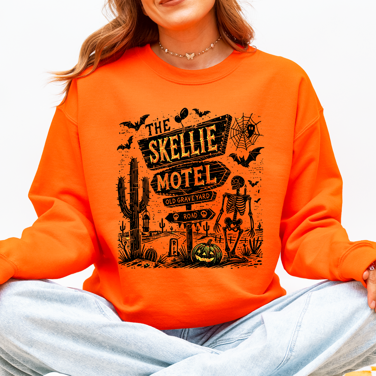 The Skellie Motel Skeleton Halloween Night Haunting Edition With Spooky Vibes And Retro Motel Aesthetic Sweatshirt