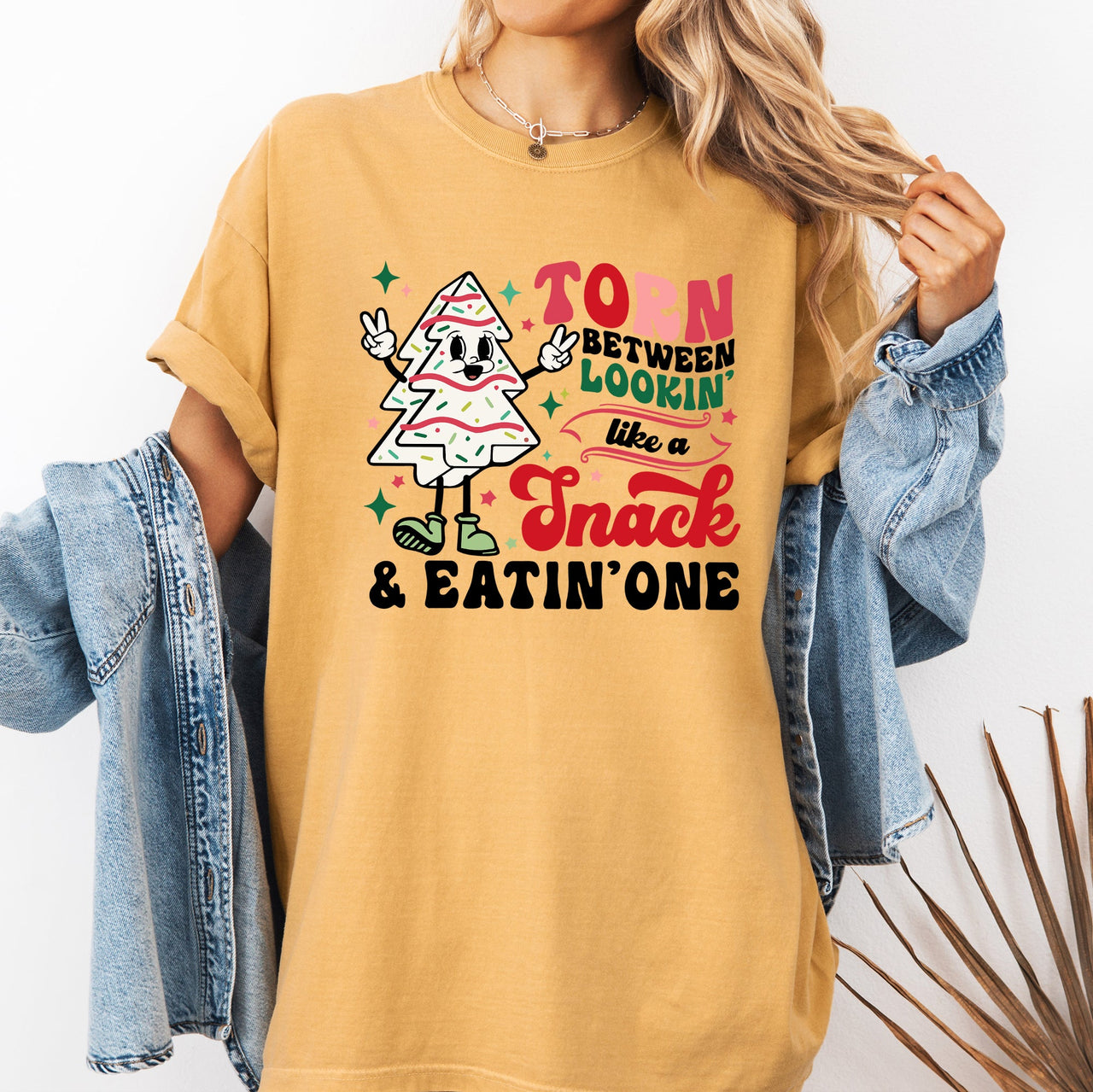 Torn Between Looking Like A Snack And Eating One Christmas Cakes Santa Winter Xmas Comfort Colors Tee