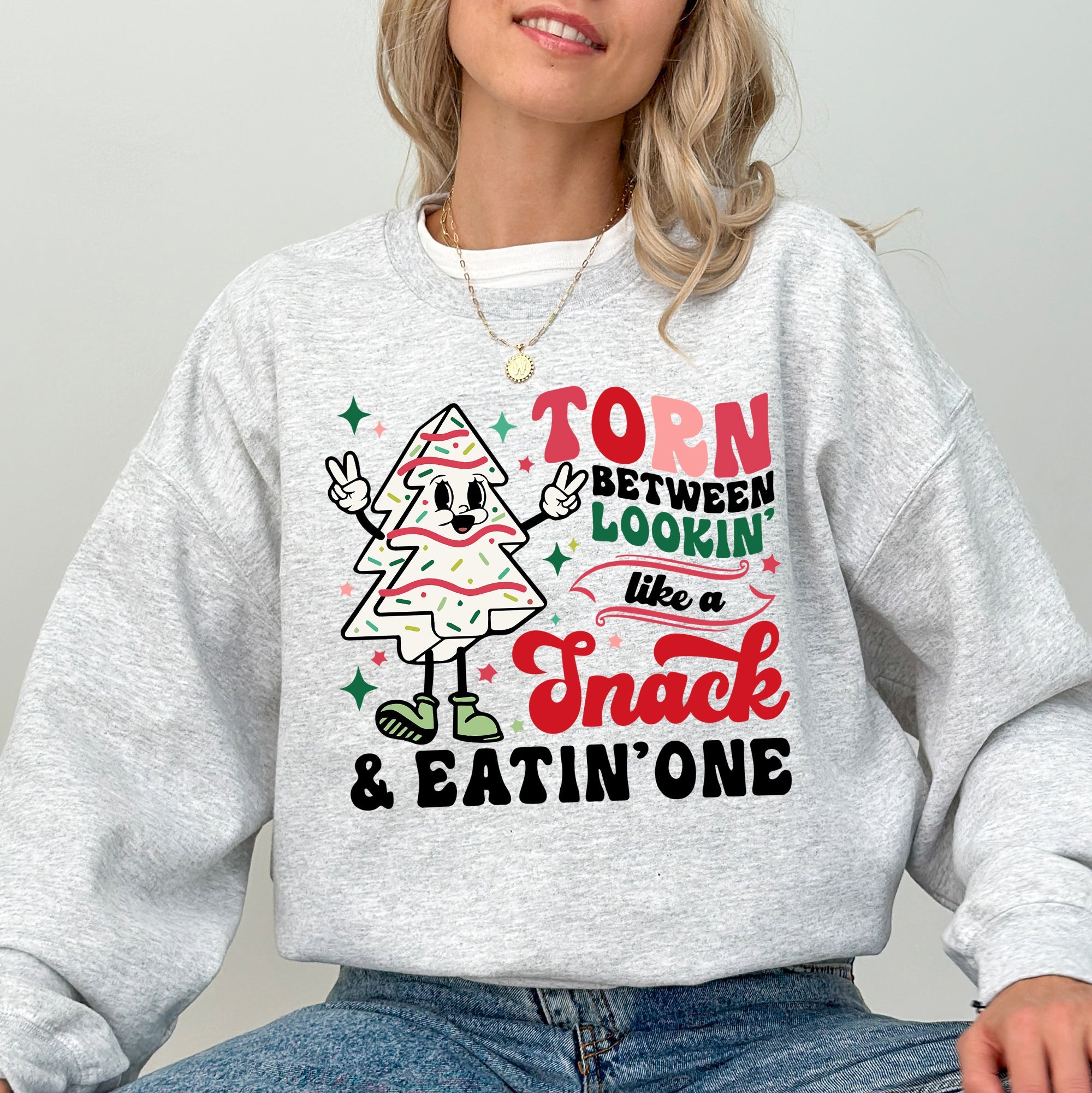 Torn Between Looking Like A Snack And Eating One Christmas Cakes Santa Winter Xmas Sweatshirt