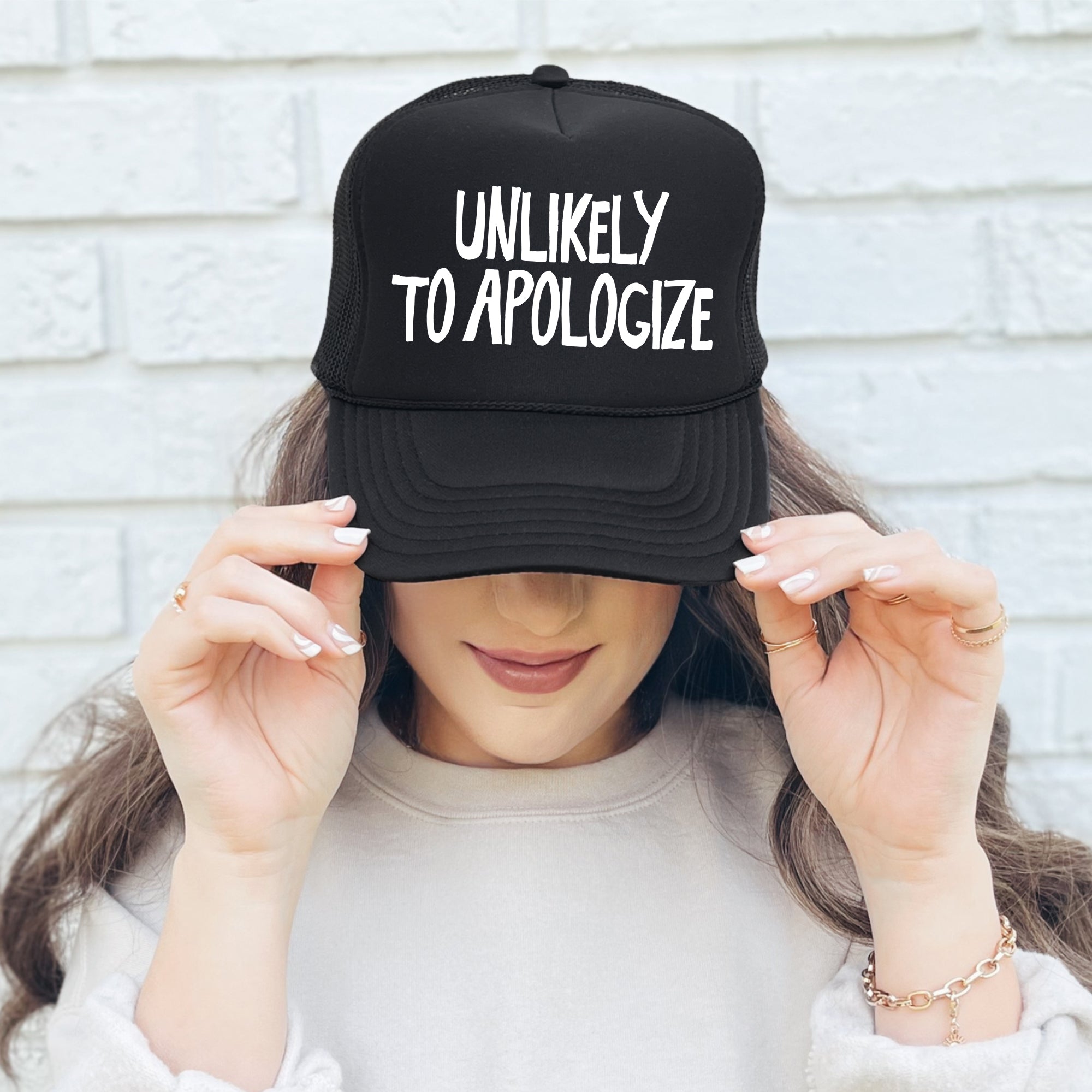 Unlikely To Apologize Bold Sassy Attitude Statement Graphic Quote Design Trucker Hat