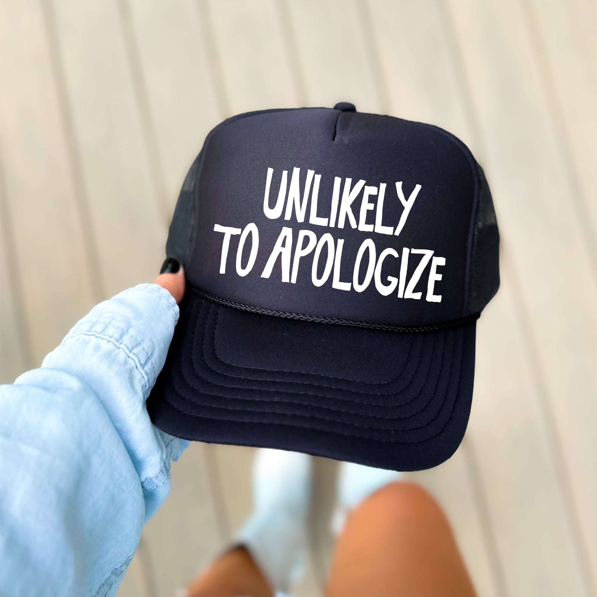 Unlikely To Apologize Bold Sassy Attitude Statement Graphic Quote Design Trucker Hat