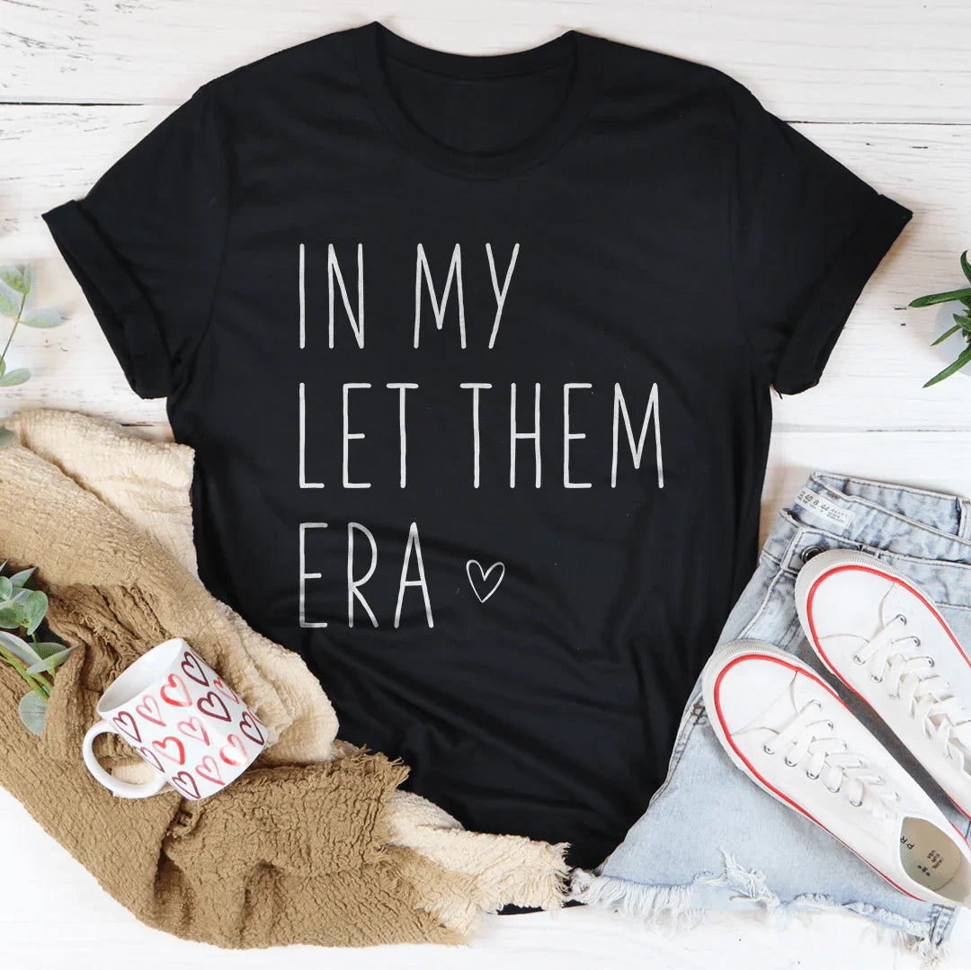 In My Let Them Era Tee